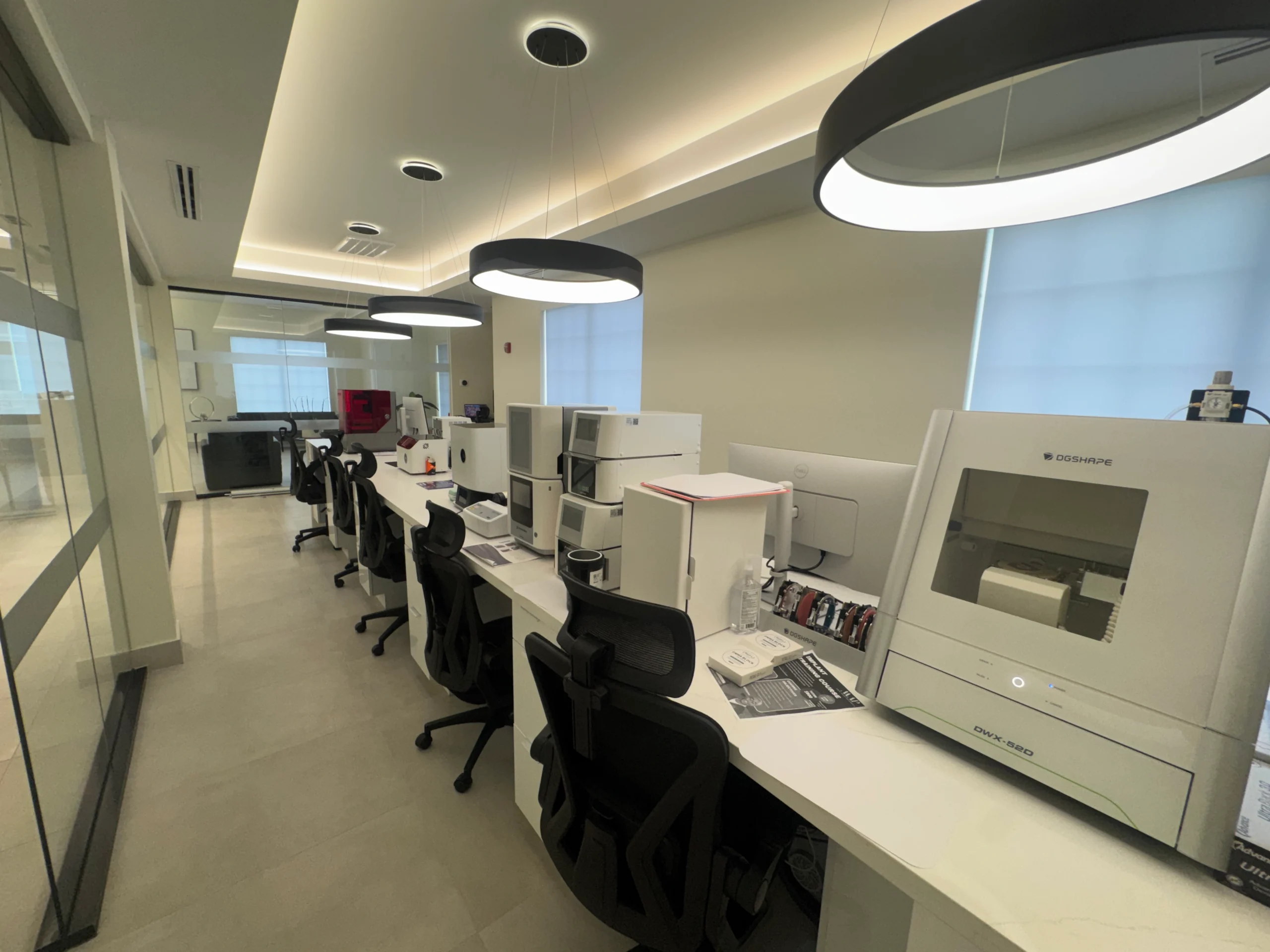 MAP Dental Center laboratory with DGSHAPE milling equipment at the right of the workbench